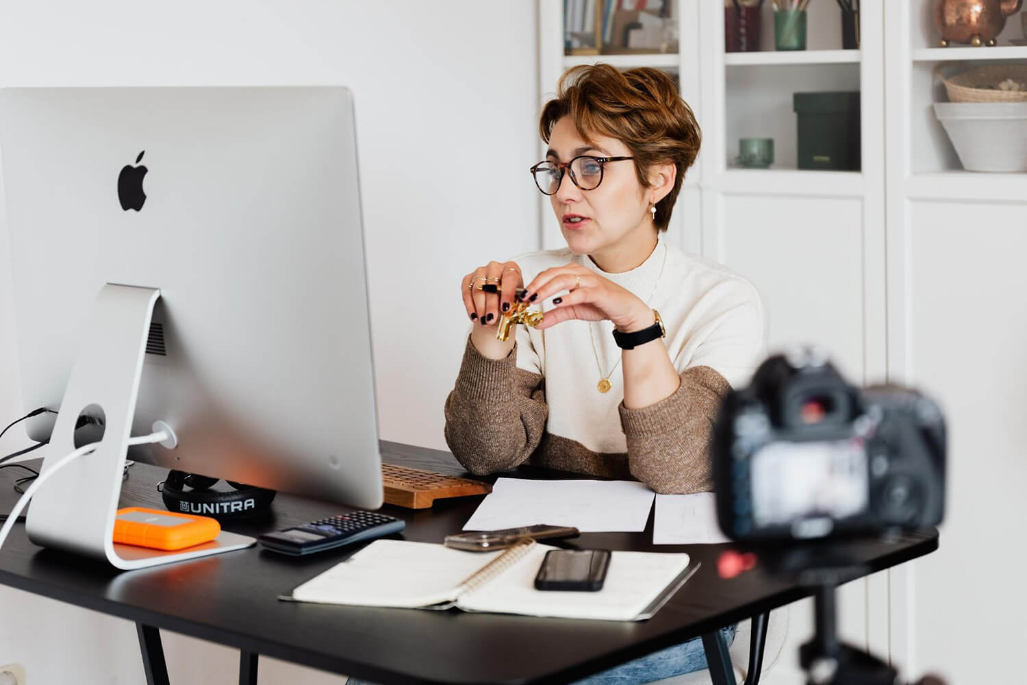 image of woman at desk designing short answer questions
