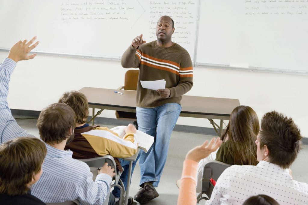 Professor pointing at student with question