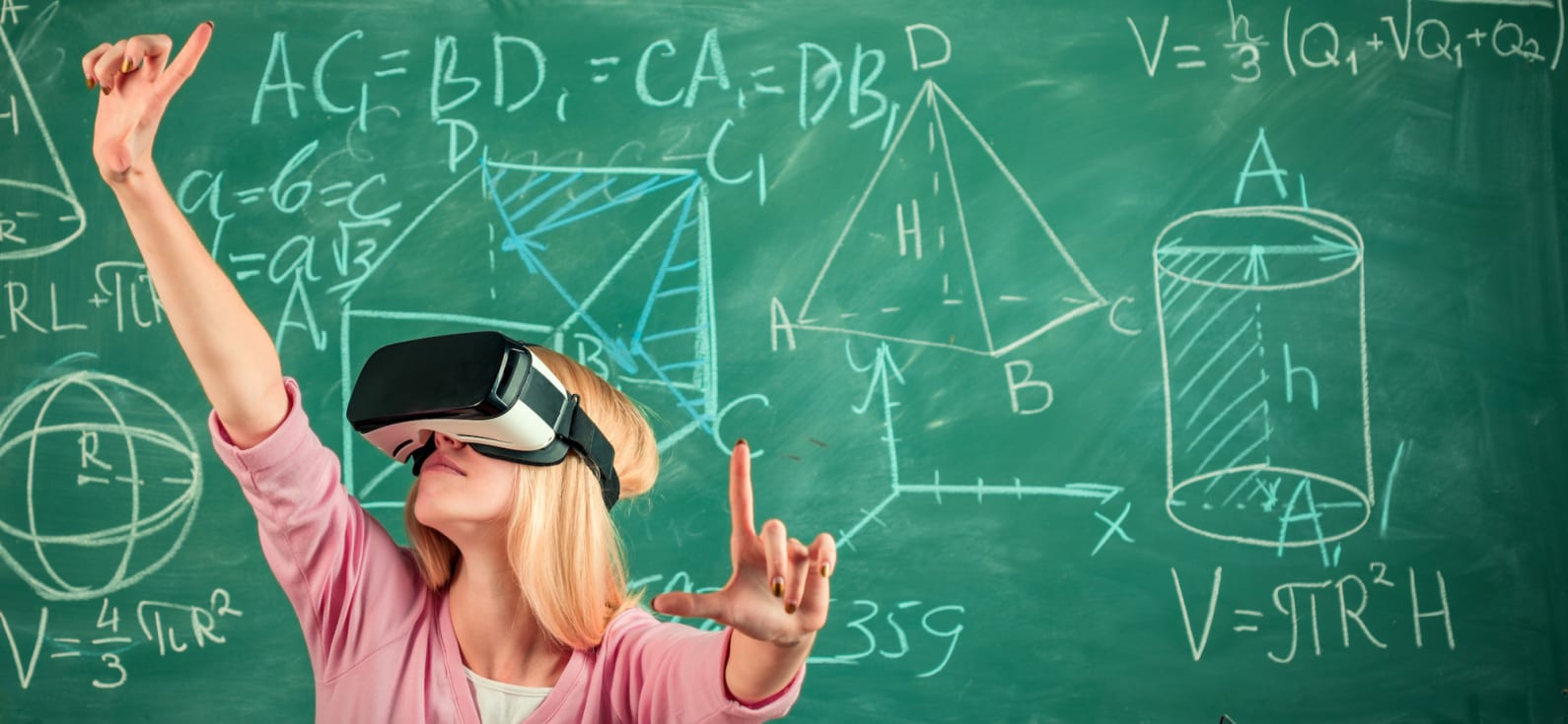 Student in a VR headset with a chalk board behind